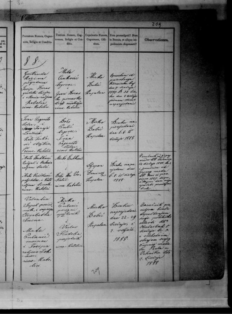 Senj, 12 January 1888 — Martin Kozina of Kranj and Angjelika Boras. The register page as read: image 214, a two-page spread: the LEFT page (printed 210) has the couple, origin, domicile and ages, the RIGHT page (printed p. 209) the parents, witnesses and priest; the entry is no. 1, the top row of both.